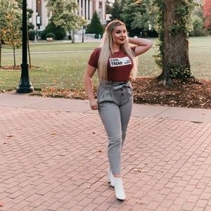 Trousers with buttons and a tie belt